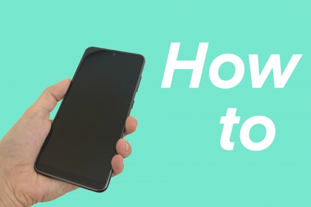 スマホを操作する手と「How to」と書かれた画像
