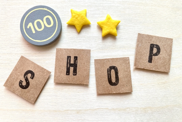 100円玉と星とShopの文字の画像
